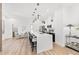 Open concept kitchen with a long island, modern lighting, and a seamless flow to the dining and living areas at 4220 N 32Nd St # 39, Phoenix, AZ 85018