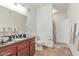 Bathroom features dark countertop, tile flooring, and shower/tub combo at 4644 N 22Nd St # 1137, Phoenix, AZ 85016