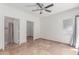 Spacious bedroom with tile flooring, ceiling fan, and walk-in closet at 4644 N 22Nd St # 1137, Phoenix, AZ 85016