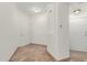 Freshly painted entryway with tile flooring, white walls, and new lighting, with a hall door to the side at 4644 N 22Nd St # 1137, Phoenix, AZ 85016
