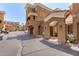 Exterior view of a multistory condo building with covered parking and walkways and desert landscaping at 4644 N 22Nd St # 1137, Phoenix, AZ 85016