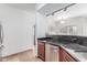 Kitchen featuring stainless dishwasher, dark countertop, and tile floors at 4644 N 22Nd St # 1137, Phoenix, AZ 85016
