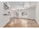 Open-concept living room with abundant light, tiled floors, and updated lighting and ceiling fan at 4644 N 22Nd St # 1137, Phoenix, AZ 85016