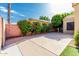 Backyard area with lush landscaping and a paved parking area at 4747 N 84Th Way, Scottsdale, AZ 85251