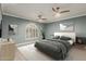 Bedroom features ceiling fan, large window with shutters, and neutral decor at 4747 N 84Th Way, Scottsdale, AZ 85251