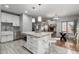 Stylish kitchen island with granite countertop and seating overlooks the living area at 4747 N 84Th Way, Scottsdale, AZ 85251