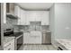 This kitchen has stainless steel appliances, granite counters, and mosaic tile backsplashes at 4747 N 84Th Way, Scottsdale, AZ 85251