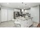 Bright kitchen features an island with a granite countertop, stainless steel appliances, and white cabinetry at 4747 N 84Th Way, Scottsdale, AZ 85251
