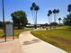 Winding pathway leads through the park, featuring picnic spots, playground, and expansive green lawns in Scottsdale, Arizona at 4747 N 84Th Way, Scottsdale, AZ 85251