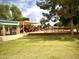 Lush green grass surrounds this inviting playground with slides, swings, and picnic tables at 4747 N 84Th Way, Scottsdale, AZ 85251