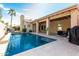 Sparkling backyard pool with patio and covered seating area, perfect for entertaining at 4747 N 84Th Way, Scottsdale, AZ 85251