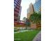 Eye-level shot of manicured courtyard showing fountains, benches and modern building architecture at 4808 N 24Th St # 527, Phoenix, AZ 85016