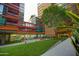 Expansive, green courtyard area with seating, a water feature, and lush landscaping at 4808 N 24Th St # 527, Phoenix, AZ 85016