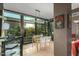 Bright dining area with large windows, modern lighting, and a minimalist table setting at 4808 N 24Th St # 527, Phoenix, AZ 85016