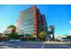 Contemporary high-rise with multiple stories, red and orange detail, and an open view of the bright blue sky at 4808 N 24Th St # 527, Phoenix, AZ 85016