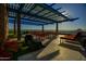 Wide angle shot of a rooftop terrace with outdoor seating, turf grass, and panoramic views at 4808 N 24Th St # 527, Phoenix, AZ 85016