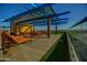 Rooftop terrace with outdoor seating, lounge chairs, turf grass, and views of the valley at 4808 N 24Th St # 527, Phoenix, AZ 85016