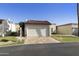 Charming single-story home with a two-car garage, tile roof, and well-manicured front lawn at 562 S Palo Verde Way, Mesa, AZ 85208