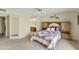 Inviting main bedroom featuring a built-in headboard, ceiling fan, and access to an ensuite bathroom at 562 S Palo Verde Way, Mesa, AZ 85208