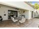 Covered patio dining set with a ceiling fan for outdoor enjoyment at 562 S Palo Verde Way, Mesa, AZ 85208