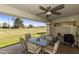 This outdoor patio features seating with a beautiful view of the community landscape at 562 S Palo Verde Way, Mesa, AZ 85208