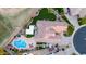 Aerial view of a backyard with a pool, outdoor seating, lush landscaping and an outdoor kitchen at 5639 S Four Peaks Pl, Chandler, AZ 85249