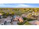 This aerial shows a home with a pool, grass, mature trees, and ample space for outdoor activities at 5639 S Four Peaks Pl, Chandler, AZ 85249