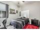 Bedroom featuring gray walls, wood floors, a black bedspread, and modern furniture at 5639 S Four Peaks Pl, Chandler, AZ 85249