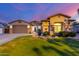 Charming single-story home boasts a well-manicured lawn and attractive desert landscaping at 5639 S Four Peaks Pl, Chandler, AZ 85249