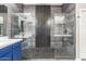 Contemporary main bathroom featuring a frameless walk-in shower and elegant gray tile at 5639 S Four Peaks Pl, Chandler, AZ 85249