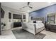 Serene main bedroom featuring a bay window and a luxurious upholstered bed at 5639 S Four Peaks Pl, Chandler, AZ 85249