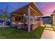 Outdoor living space with a covered patio, built-in grill, fireplace, and outdoor seating at 5639 S Four Peaks Pl, Chandler, AZ 85249