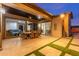 Covered patio with tiled floors, outdoor dining furniture, and views of the backyard at 5639 S Four Peaks Pl, Chandler, AZ 85249