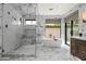 Elegant bathroom featuring a glass shower, soaking tub, and marble accents at 5740 N Casa Blanca Dr, Paradise Valley, AZ 85253