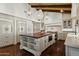 Spacious kitchen featuring a large center island, custom cabinets, and modern appliances at 5740 N Casa Blanca Dr, Paradise Valley, AZ 85253