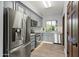 Modern kitchen with stainless steel appliances, gray cabinetry, and bright lighting creating an efficient cooking space at 5740 N Casa Blanca Dr, Paradise Valley, AZ 85253