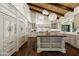 Spacious kitchen with a large island, custom cabinetry, and high-end appliances, illuminated by stylish pendant lighting at 5740 N Casa Blanca Dr, Paradise Valley, AZ 85253