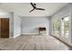 Spacious room with wood floors, fan and French doors offering natural light and access to outdoor beauty at 5740 N Casa Blanca Dr, Paradise Valley, AZ 85253