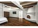 Comfortable main bedroom boasting a modern fireplace, a cozy aesthetic, and wood-beam ceilings at 5740 N Casa Blanca Dr, Paradise Valley, AZ 85253