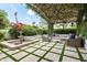 Inviting covered patio with elegant seating, decorative water feature, and lush greenery, perfect for outdoor living at 5740 N Casa Blanca Dr, Paradise Valley, AZ 85253