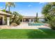 Lush lawn, pristine pool, and well-maintained landscaping offer a serene outdoor setting for leisure and relaxation at 5740 N Casa Blanca Dr, Paradise Valley, AZ 85253