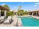 Stunning pool area featuring ample seating, lush greenery, and a pristine pool, creating a serene and luxurious outdoor oasis at 5740 N Casa Blanca Dr, Paradise Valley, AZ 85253