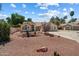 Charming single-story home with desert landscaping and a tile roof under a partly cloudy sky at 63 W Los Arboles Dr, Tempe, AZ 85284