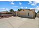 Spacious three-car garage with extended driveway and gated side yard at 63 W Los Arboles Dr, Tempe, AZ 85284