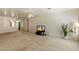 Spacious living room with neutral carpet, a ceiling fan, and views to the entry way at 63 W Los Arboles Dr, Tempe, AZ 85284