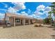 Inviting backyard with desert landscaping, covered patio, and serene outdoor seating at 6372 S Callaway Dr, Chandler, AZ 85249