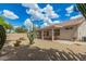 Charming backyard with desert landscaping, covered patio, and serene seating area at 6372 S Callaway Dr, Chandler, AZ 85249