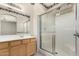 A view of a shower with sliding glass doors, with a double vanity in the background at 6372 S Callaway Dr, Chandler, AZ 85249