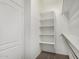 A well-organized walk-in closet with built-in shelving and ample storage space at 6372 S Callaway Dr, Chandler, AZ 85249