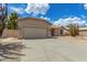 Single story home with a two-car garage and low maintenance desert landscaping at 6372 S Callaway Dr, Chandler, AZ 85249